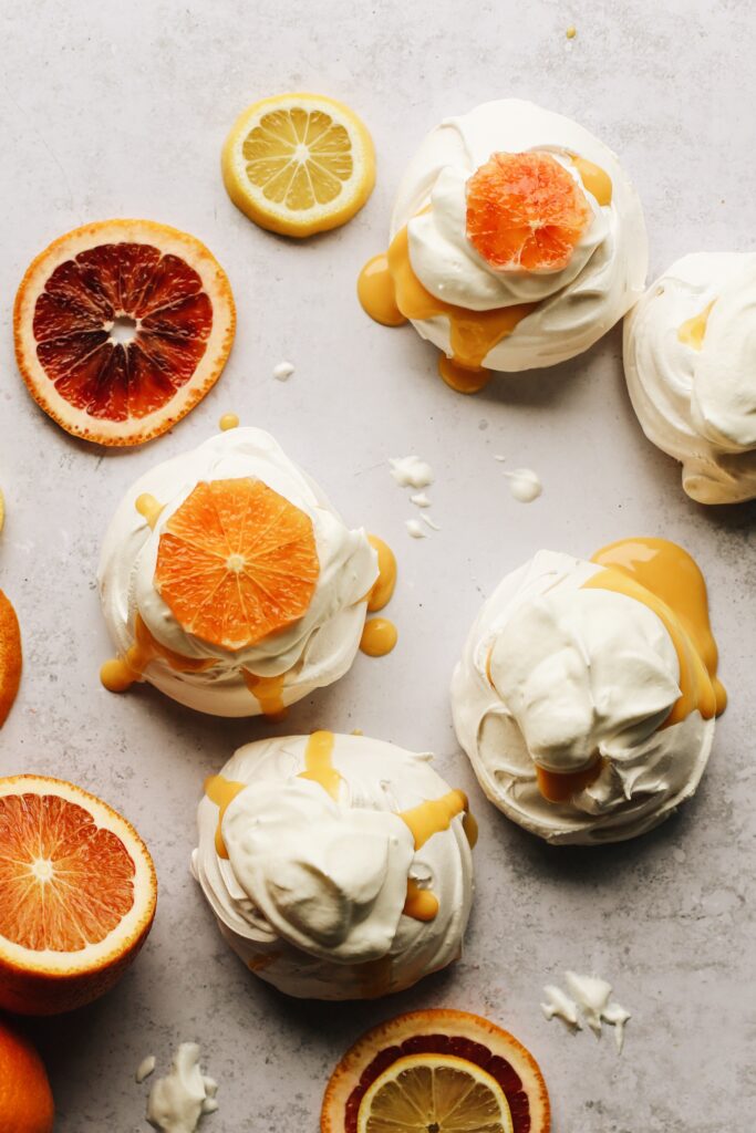 this is how the mini pavlovas look filled with blood orange curd, then topped with whipped cream and slices of blood oranges. 