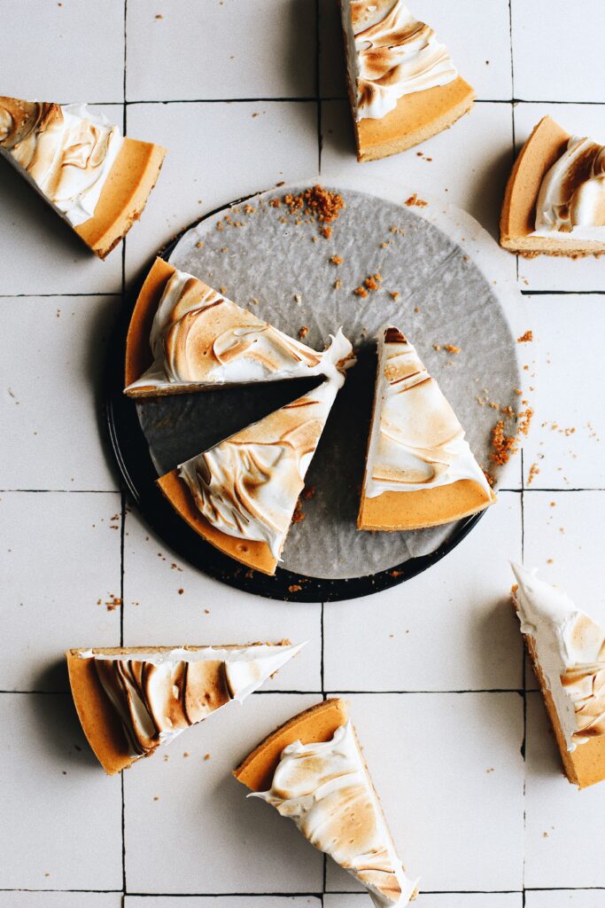 pumpkin cheesecake with gingersnap crust and toasted meringue